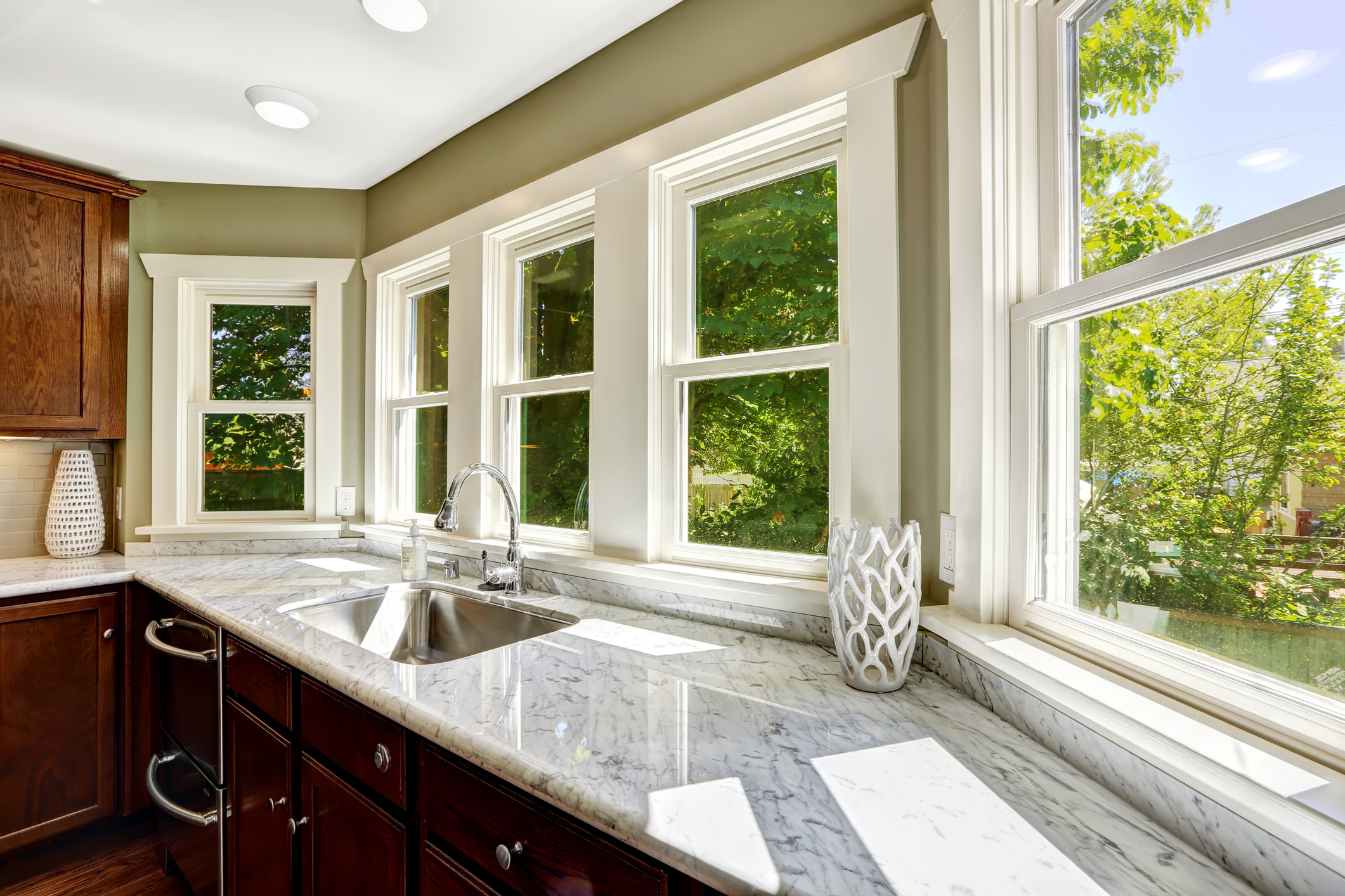 Beautiful kitchen cabinet with marble top, steel sink, fiberglass windows - Waterford Window Replacement